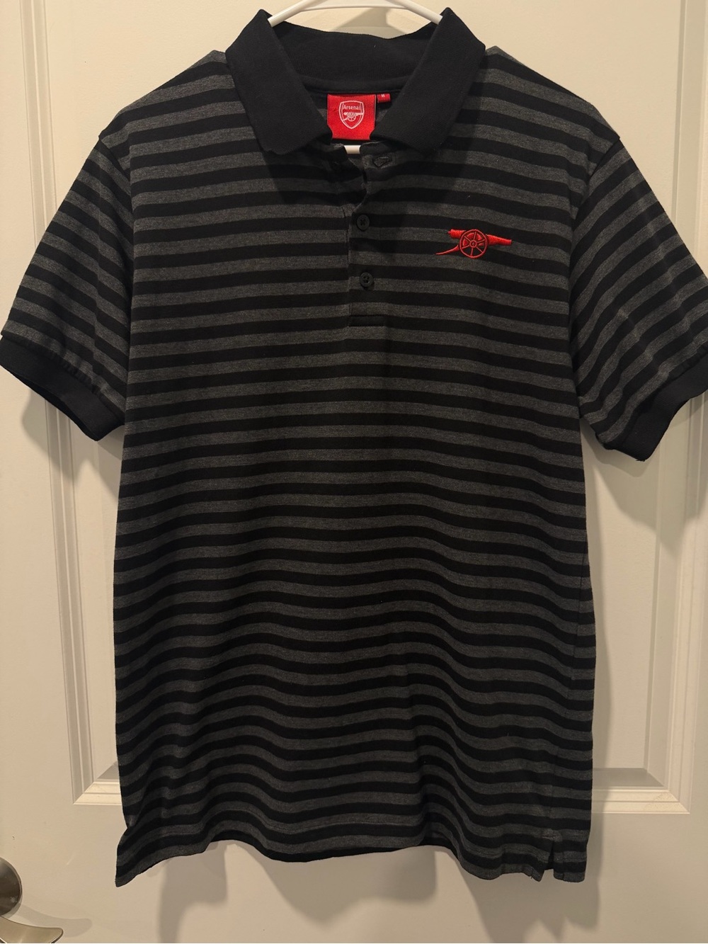 Men's Arsenal Black Striped Polo with Red Chest Accent